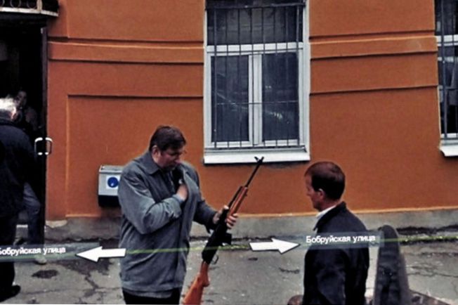 Imagen de un hombre con un rifle